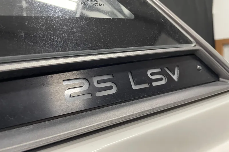 Slide: The Image of Close-up of 2019 Malibu Wakesetter 25 LSV boat emblem. - 5