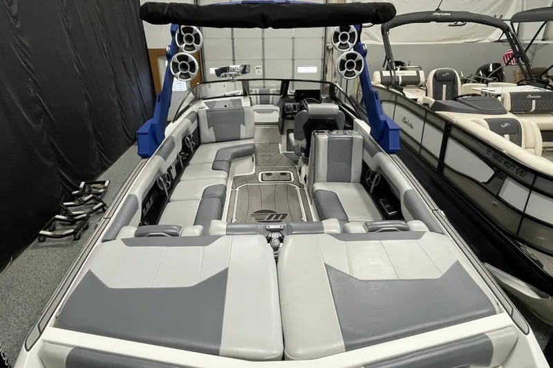 Slide: The Image of 2019 Malibu Wakesetter 25 LSV interior with gray seating and advanced audio system. - 7