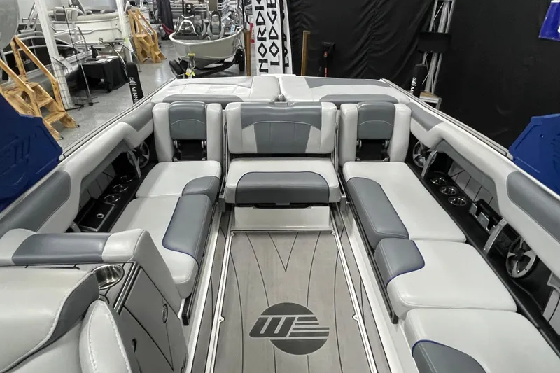 Slide: The Image of 2019 Malibu Wakesetter 25 LSV interior with spacious seating and modern design. - 9