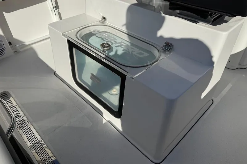 Slide: The Image of 2026 Sea Pro 245FLX Sandbar boat interior with storage compartment and sleek design. - 14