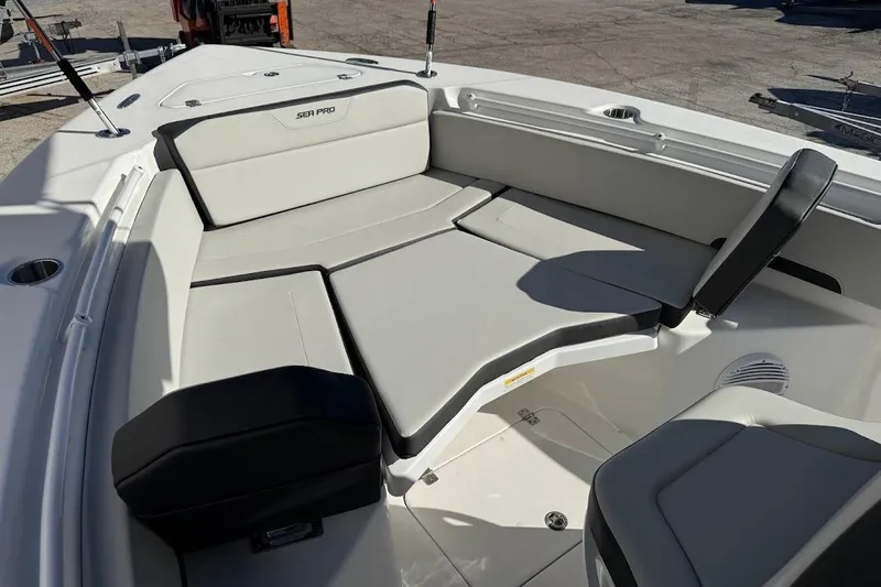 Slide: The Image of 2026 Sea Pro 245FLX Sandbar boat interior with cushioned seating and sleek design. - 19