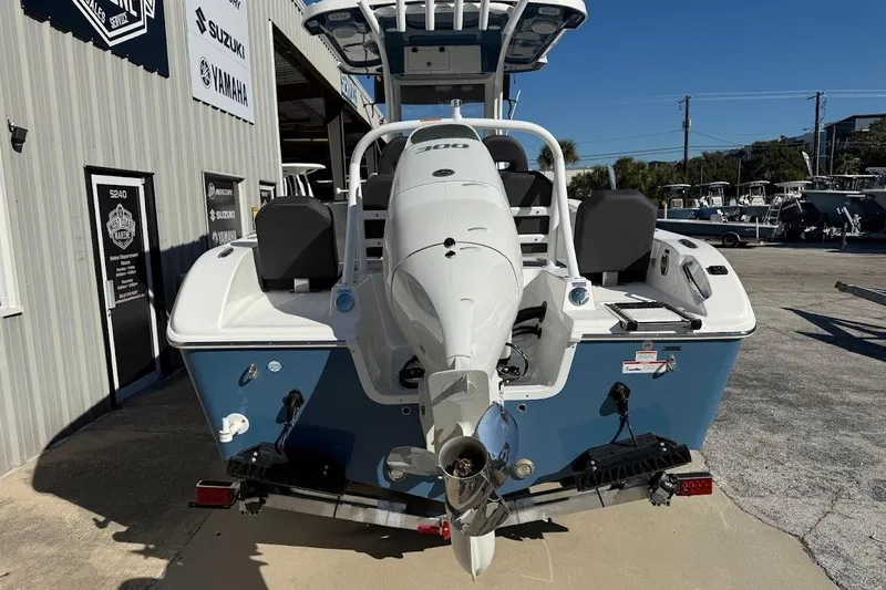Slide: The Image of 2026 Sea Pro 245FLX Sandbar boat with powerful outboard motor, parked at dealership. - 6