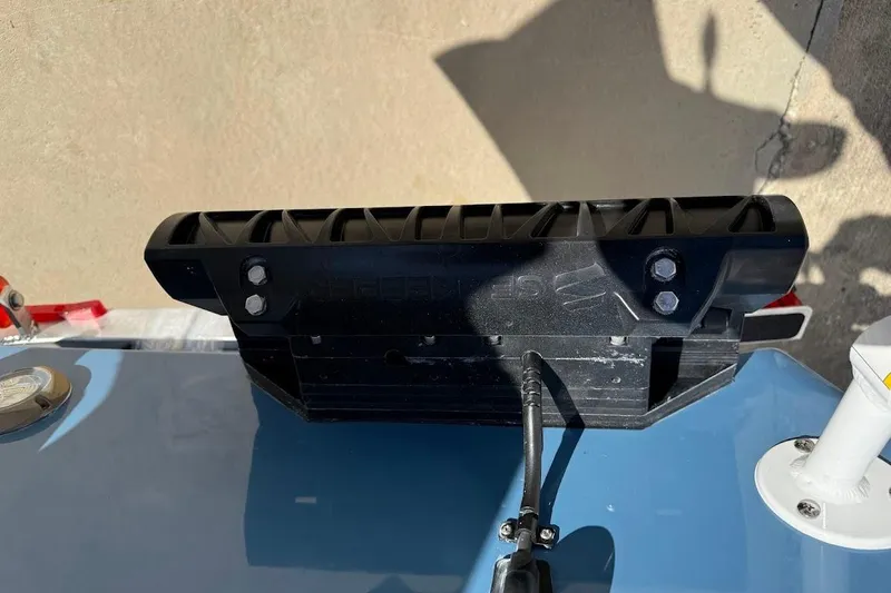 Slide: The Image of Close-up of 2026 Sea Pro 245FLX Sandbar boat component with black mounting bracket. - 7