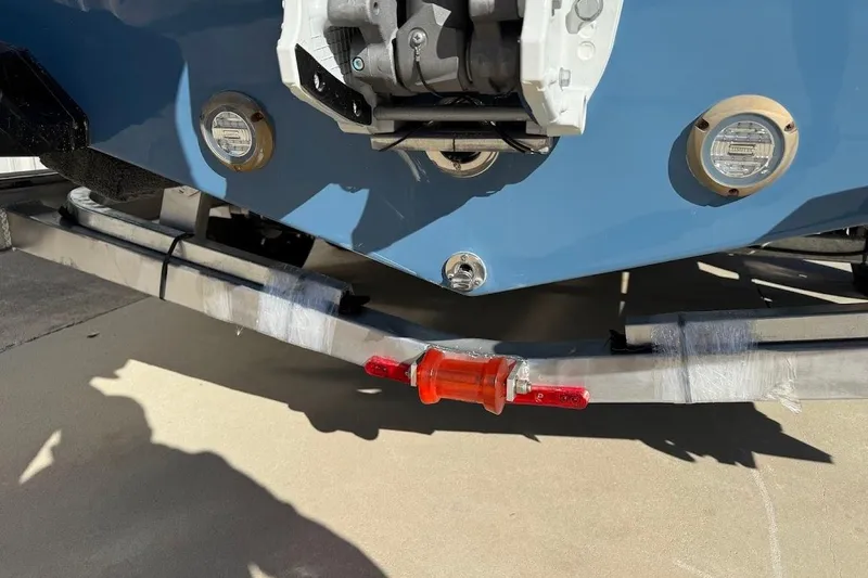 Slide: The Image of 2026 Sea Pro 245FLX Sandbar boat on trailer, showing rear view and trailer light. - 9