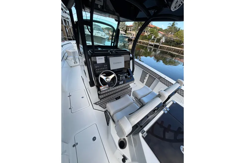 Slide: The Image of 2021 Wellcraft 302 Scarab boat interior with sleek seating and modern design. - 10