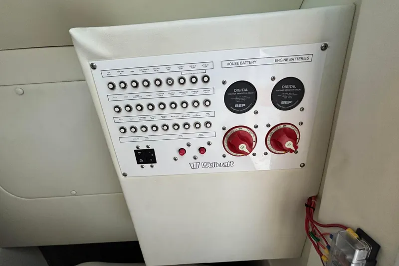 Slide: The Image of Open storage compartment on 2021 Wellcraft 302 Scarab boat with red item inside. - 13