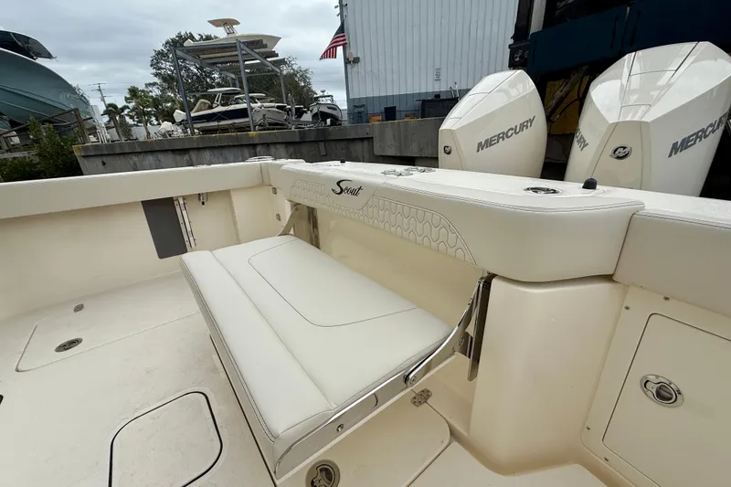 Slide: The Image of 2026 Scout 288 LXF boat interior with seating and Mercury engines. - 17