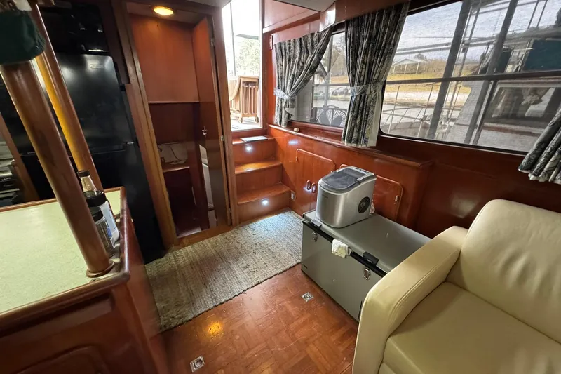 Slide: The Image of Interior of 1991 DeFever 44 yacht with wood paneling and modern amenities. - 40