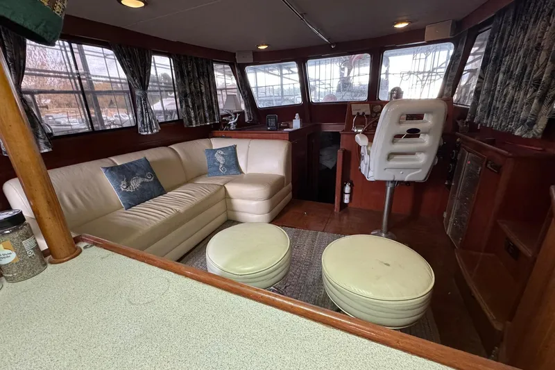 Slide: The Image of Luxurious 1991 DeFever 44 yacht interior with plush seating and nautical decor. - 42