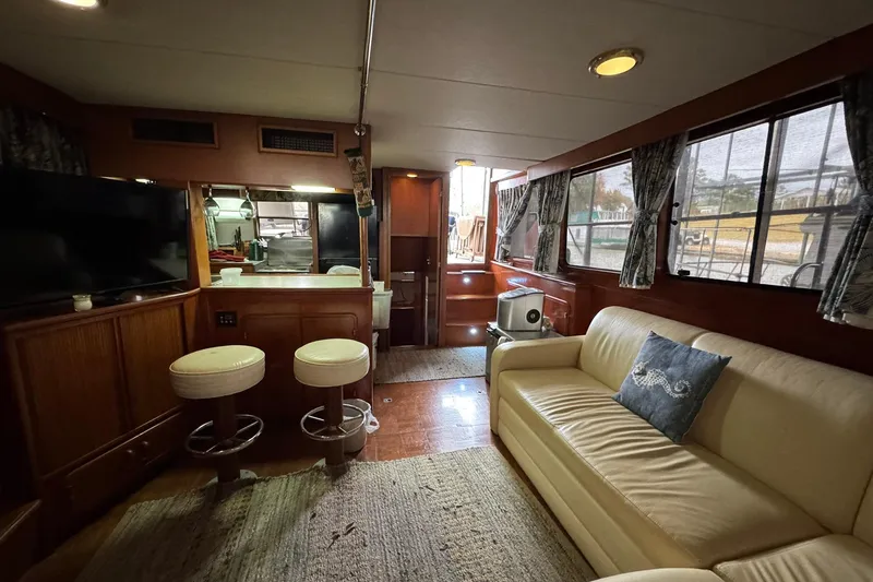 Slide: The Image of Interior of 1991 DeFever 44 yacht with cozy seating and modern amenities. - 49