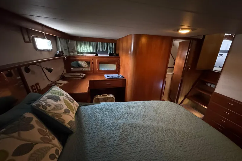 Slide: The Image of Cozy cabin interior of 1991 DeFever 44 yacht with bed and wooden furnishings. - 52