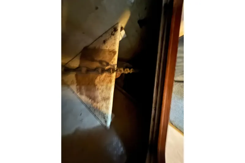 Slide: The Image of Anchor chain on 1991 DeFever 44 boat, close-up view. - 61