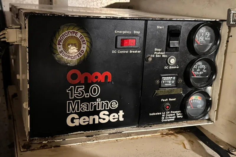 Slide: The Image of Onan 15.0 Marine GenSet control panel on a 1991 DeFever 44 boat. - 74