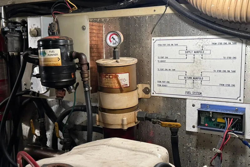 Slide: The Image of Engine room of 1991 DeFever 44 with fuel purifier and manifold diagram. - 76
