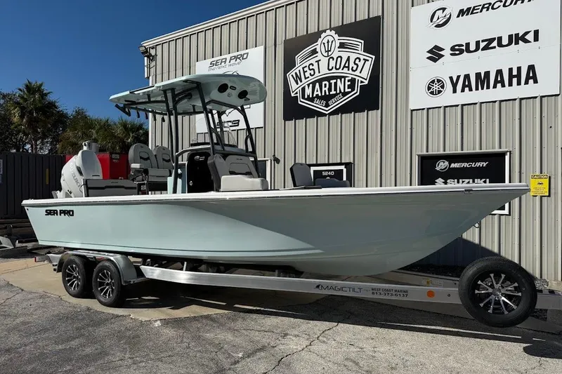 The Image of 2026 Sea Pro 250 Bay boat on trailer at West Coast Marine dealership. - 1
