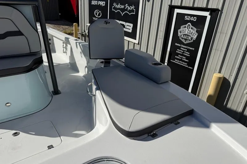 Slide: The Image of 2026 Sea Pro 250 Bay boat interior with seating and cup holder. - 22