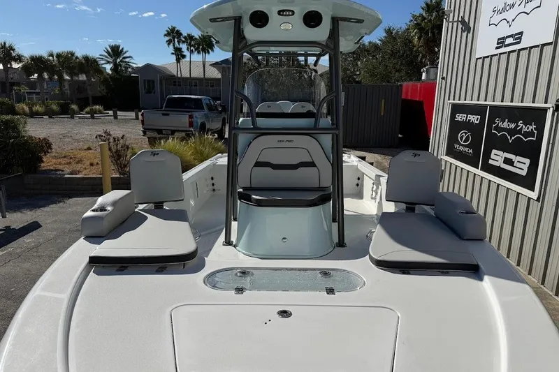 Slide: The Image of 2026 Sea Pro 250 Bay boat with seating, console, and outdoor setting. - 3