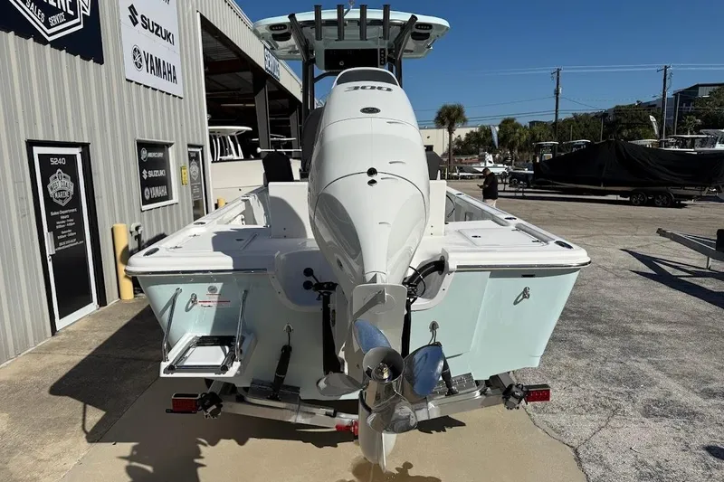 Slide: The Image of 2026 Sea Pro 250 Bay boat with outboard motor at a marina. - 5
