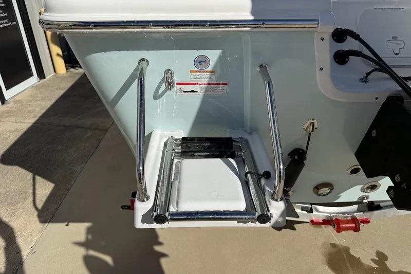 Slide: The Image of 2026 Sea Pro 250 Bay boat ladder and stern details in sunlight. - 6