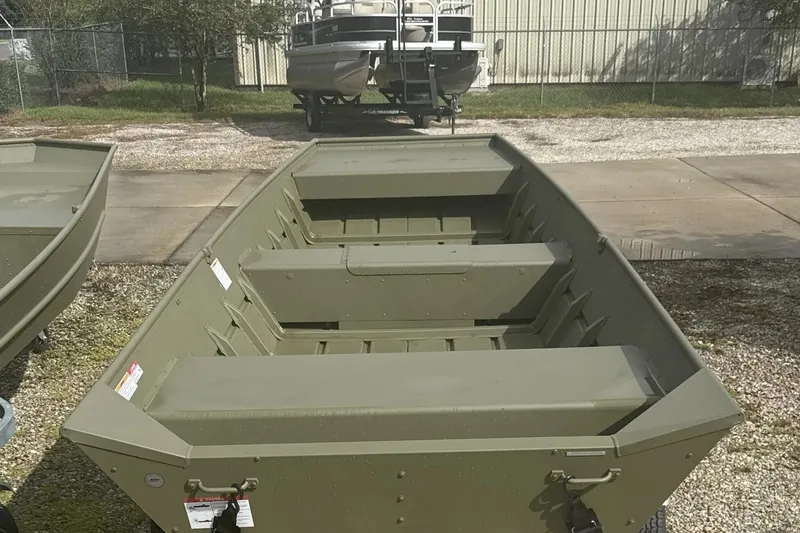 Slide: The Image of 2026 Lowe L1448 Jon boat in outdoor setting, showcasing its sturdy design. - 5