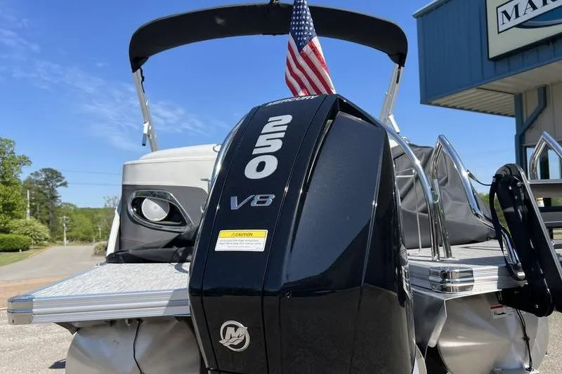 Slide: The Image of 2023 Barletta Corsa 23Q pontoon boat with powerful 250 V8 engine and American flag. - 8