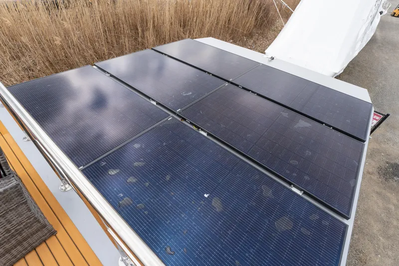 Slide: The Image of Solar panels on Waterlodge Apart M 2024, eco-friendly energy solution. - 30