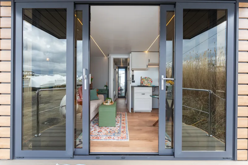 Slide: The Image of 2024 Waterlodge Apart M interior view, featuring modern design and cozy living space. - 32