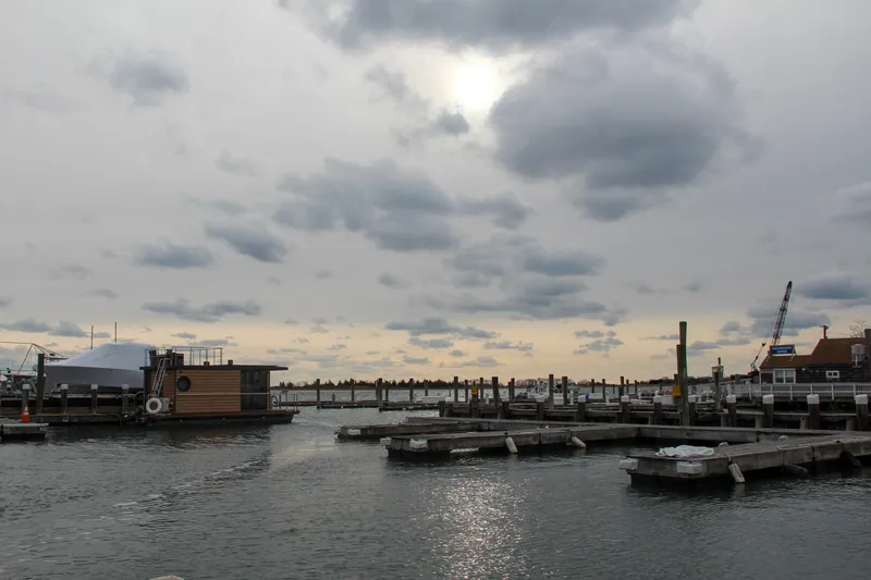 Slide: The Image of Modern Waterlodge Apart M houseboat docked in a serene marina, 2024 model. - 34