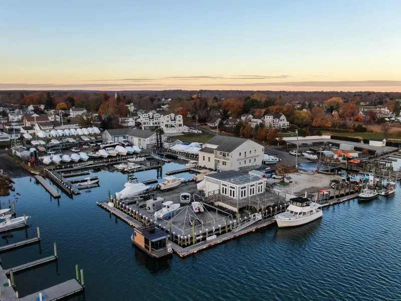 Slide: The Image of Aerial view of marina with Waterlodge Apart M houseboat, 2024 model, docked at sunset. - 39