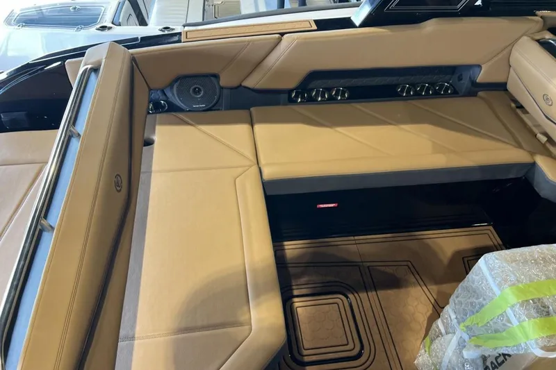 Slide: The Image of 2026 Cobalt R8 Surf boat interior with tan seating and modern design features. - 17