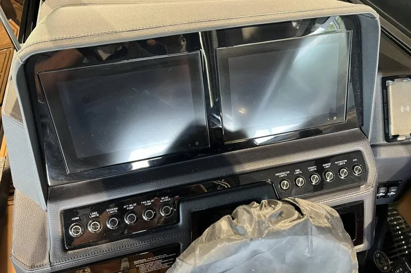 Slide: The Image of 2026 Cobalt R8 Surf dashboard with dual screens and control panel. - 20