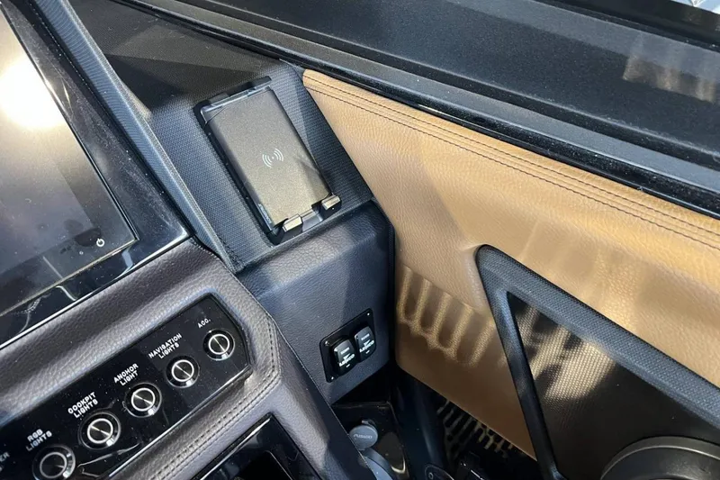 Slide: The Image of 2026 Cobalt R8 Surf interior with wireless charging pad and control panel. - 21