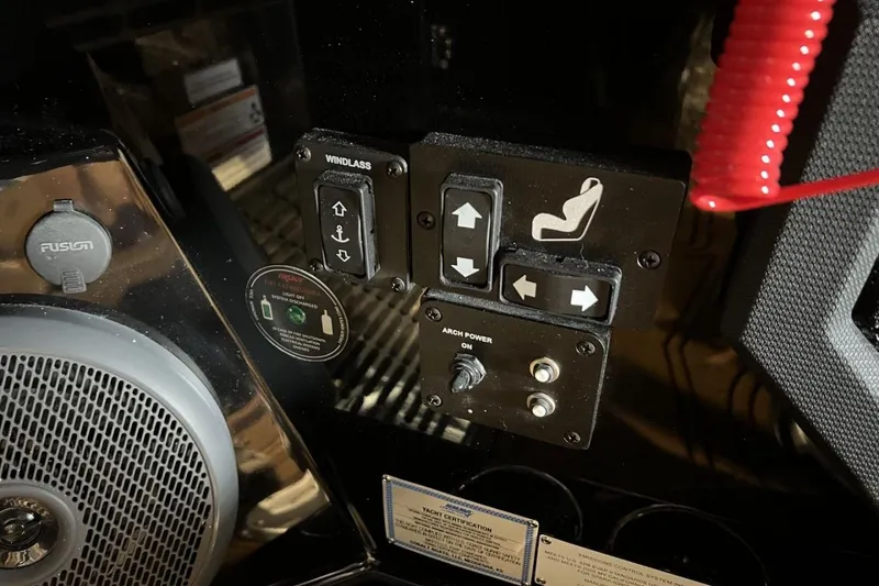 Slide: The Image of Control panel of 2026 Cobalt R8 Surf boat with speaker and switches. - 22