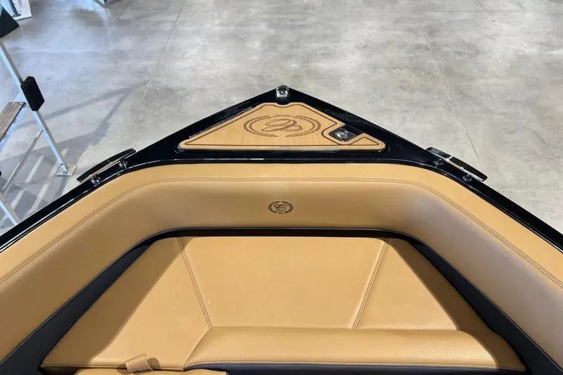 Slide: The Image of 2026 Cobalt R8 Surf boat interior with tan leather seating and sleek design. - 25