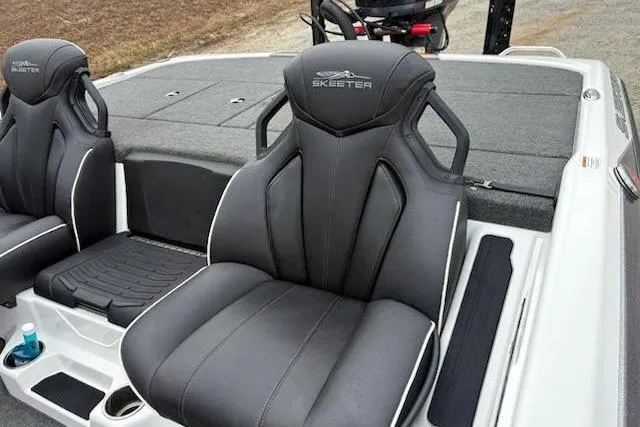 Slide: The Image of 2023 Skeeter ZXR20 boat seats with sleek black design and modern features. - 13