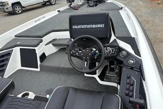 Slide: The Image of 2023 Skeeter ZXR20 boat interior with Humminbird electronics and steering wheel. - 8
