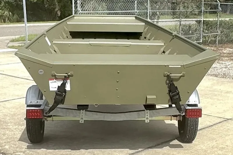 Slide: The Image of 2026 Lowe L1648 Jon boat on trailer, parked outdoors. - 5