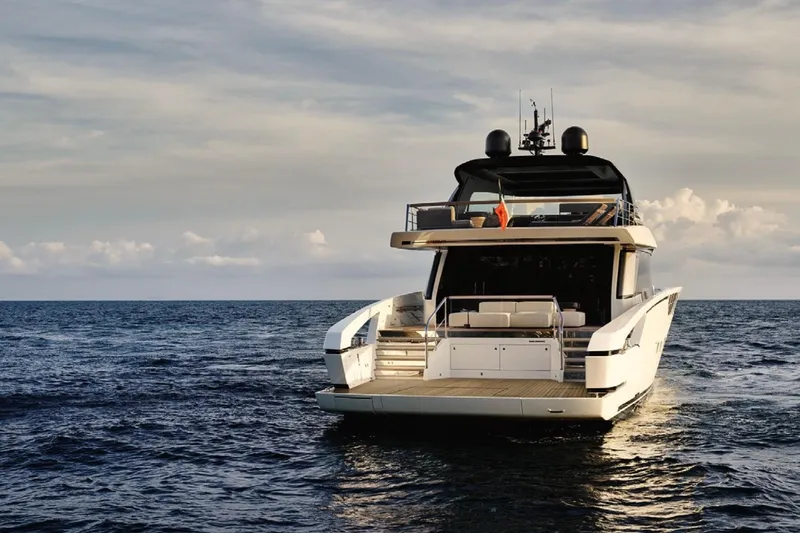 Slide: The Image of Luxury Sanlorenzo SX88 yacht on open sea, 2025 model, rear view. - 2