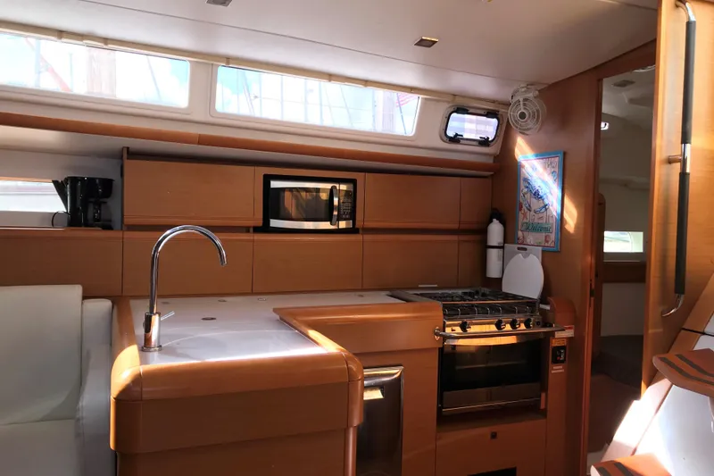 Slide: The Image of Interior of 2015 Jeanneau Sun Odyssey 469 yacht kitchen with modern appliances. - 10