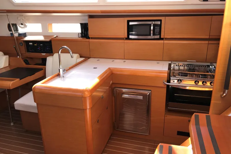 Slide: The Image of Interior of 2015 Jeanneau Sun Odyssey 469 yacht kitchen with modern amenities. - 12