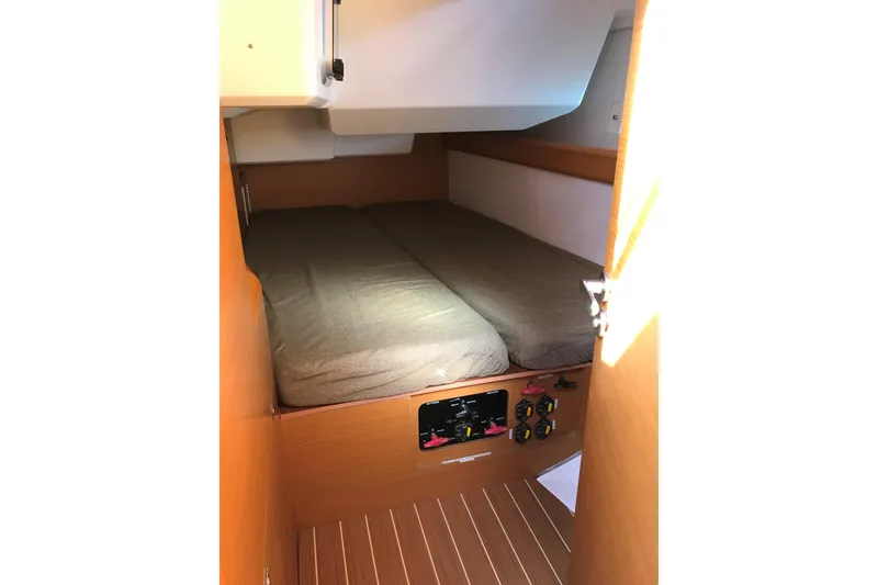 Slide: The Image of Cabin interior of 2015 Jeanneau Sun Odyssey 469 sailboat with cozy bed and control panel. - 15