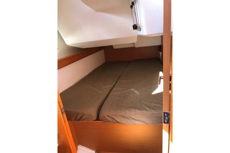 Slide: The Image of Cabin interior of 2015 Jeanneau Sun Odyssey 469 sailboat with cozy bedding. - 17