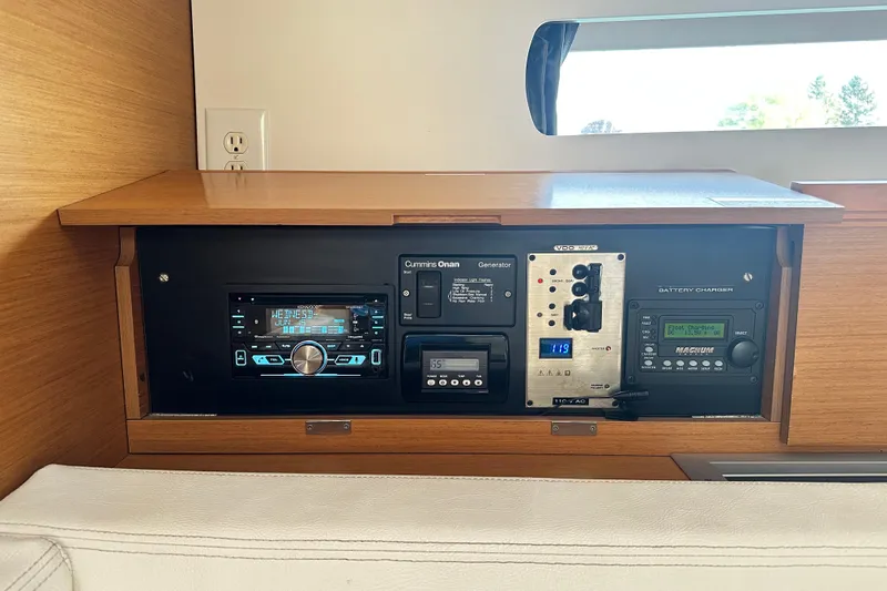 Slide: The Image of Control panel of a 2015 Jeanneau Sun Odyssey 469 yacht, featuring navigation and battery systems. - 23