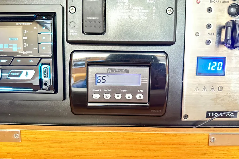 Slide: The Image of Control panel of a 2015 Jeanneau Sun Odyssey 469 yacht, displaying temperature and settings. - 25