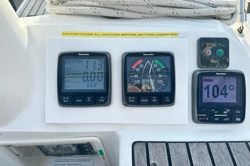 Slide: The Image of Jeanneau Sun Odyssey 469, 2015 model, featuring Raymarine navigation instruments on deck. - 28