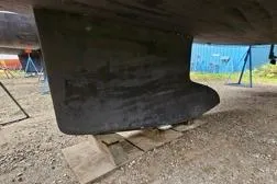 Slide: The Image of Keel of 2015 Jeanneau Sun Odyssey 469 sailboat on dry dock. - 37