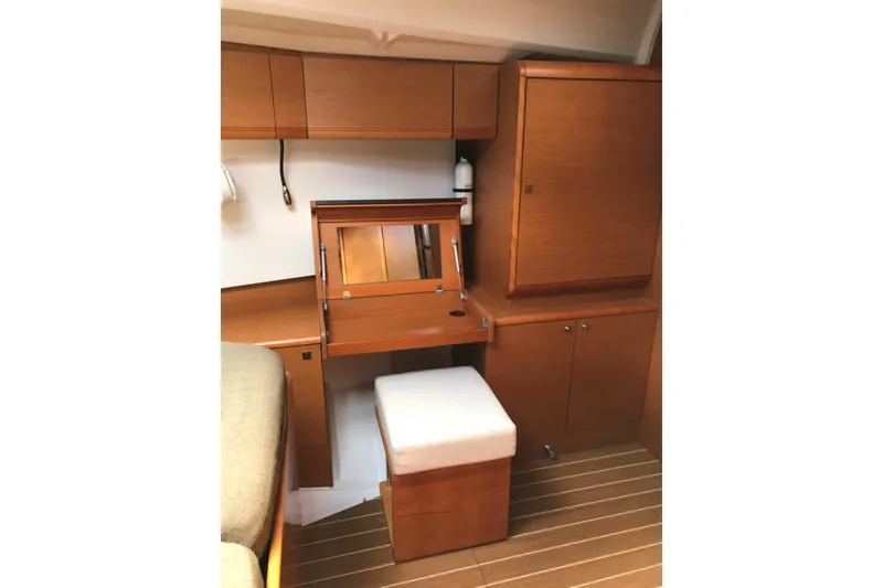 Slide: The Image of Interior of 2015 Jeanneau Sun Odyssey 469 yacht with wooden cabinetry and seating. - 7