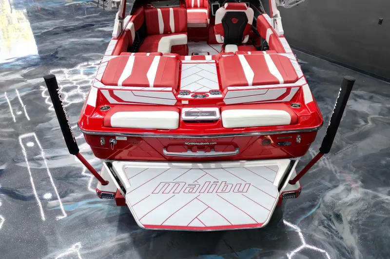 Slide: The Image of 2023 Malibu Wakesetter 22 LSV boat, red and white interior, sleek design. - 10