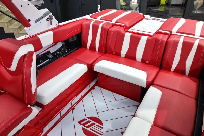 Slide: The Image of 2023 Malibu Wakesetter 22 LSV interior with red and white seating design. - 8