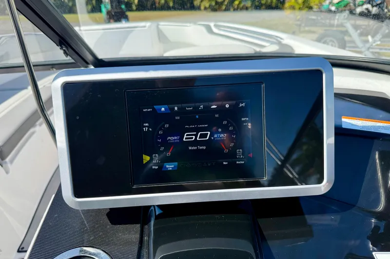 Slide: The Image of 2024 Yamaha Boats SX250 dashboard display showing speed and navigation details. - 13